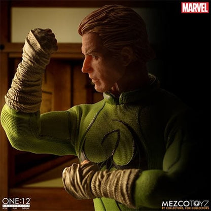 Iron Fist One:12 Collective Action Figure - ReRun — unmasked side portrait with raised fist