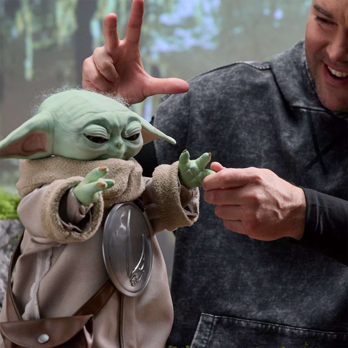 Star Wars Ultimate Grogu 1:1 Scale Premium Animatronic Replica — raised-hands interaction close-up