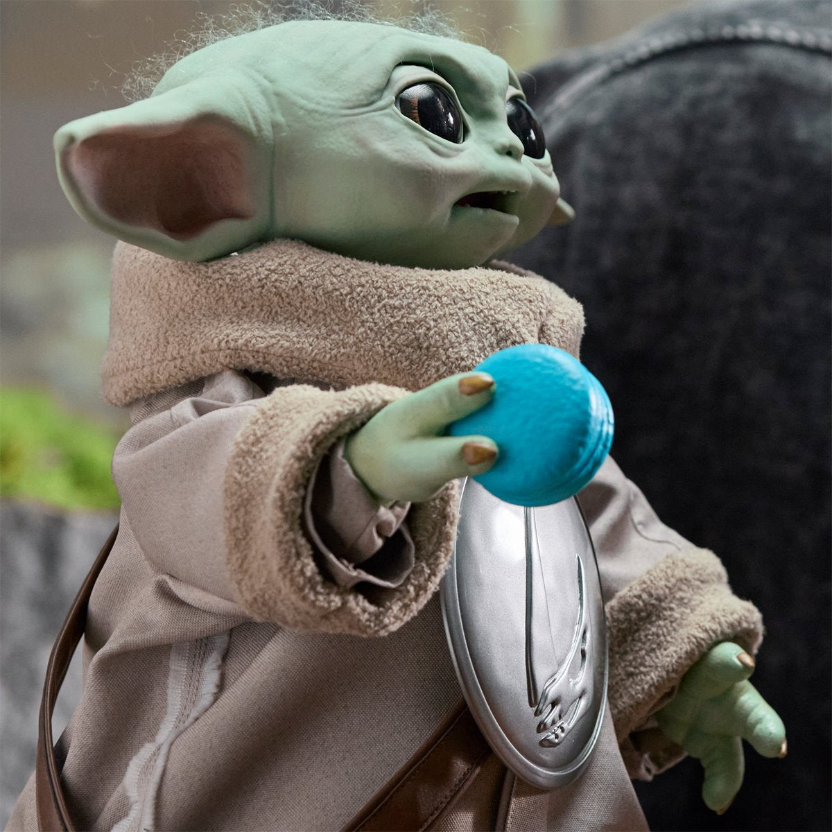 Star Wars Ultimate Grogu 1:1 Scale Premium Animatronic Replica — side view holding blue accessory